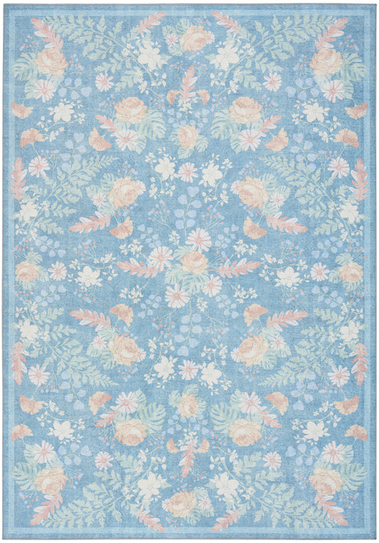 Blue floral area rug with peach and cream blossoms and leafy motifs, bordered edge.
