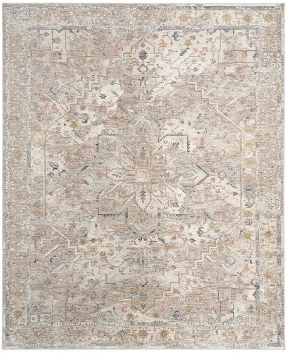 Rectangular distressed Persian rug in ivory, beige and gray with pale blue accents and a central floral medallion.