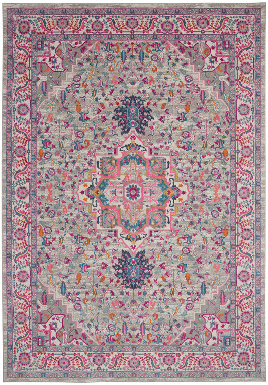 Colorful Persian-style rug with a central medallion on a light gray field, featuring pinks, teals, blues and intricate floral borders.