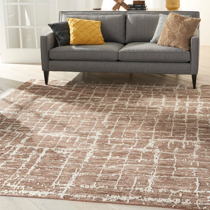 Gray rug with a beige-brown lattice pattern; mustard yellow, black, gray, and brown textured accents.