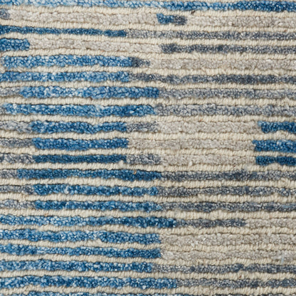 Blue and cream striped textured rug with thick loop pile, casual contemporary decor.