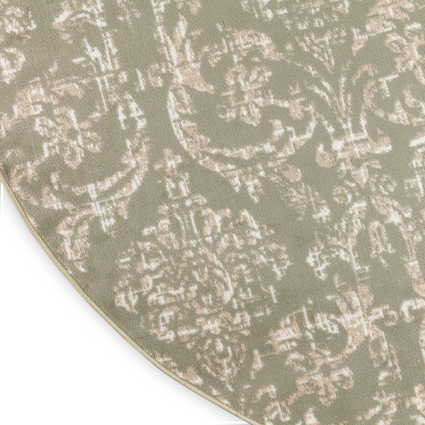 Round sage green rug with ivory damask pattern, soft woven textile for living room decor.