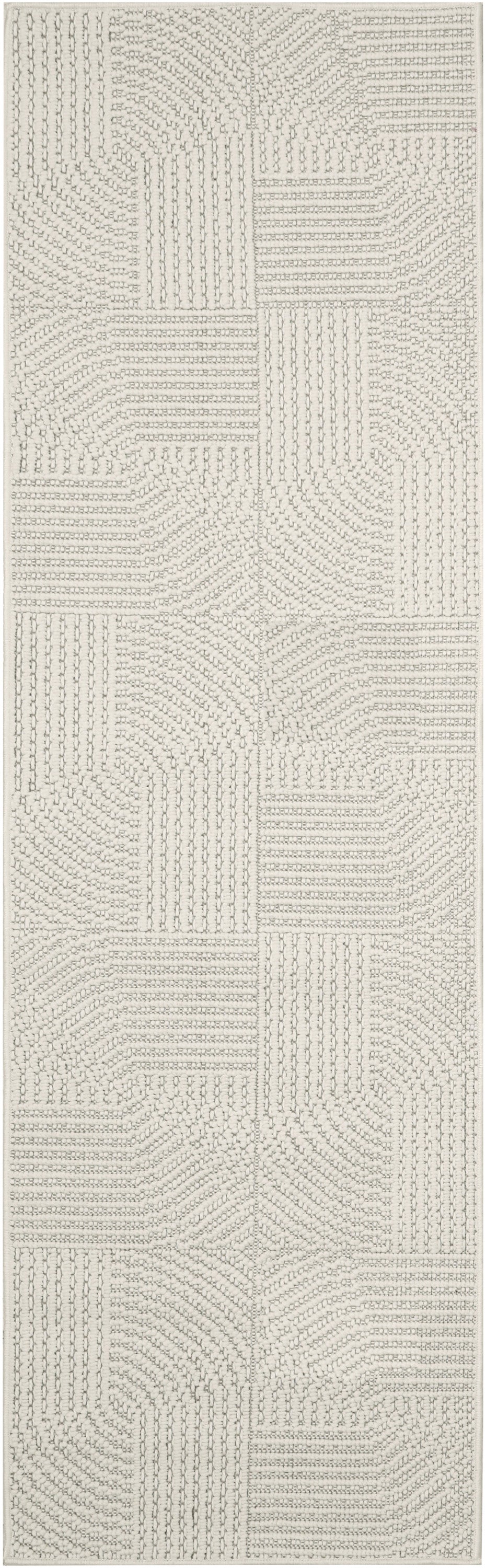 Cream off-white runner rug with geometric patchwork of raised linear loops and dotted texture.