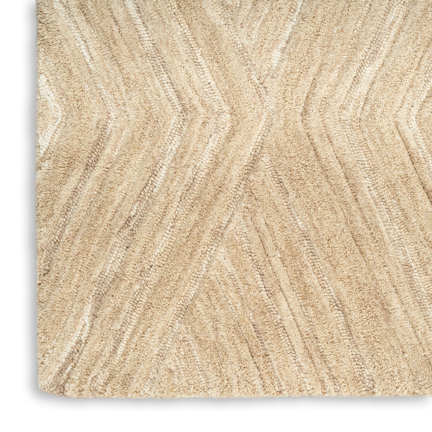 Beige textured area rug with subtle chevron zigzag pattern in cream & tan tones; soft pile, rectangular.