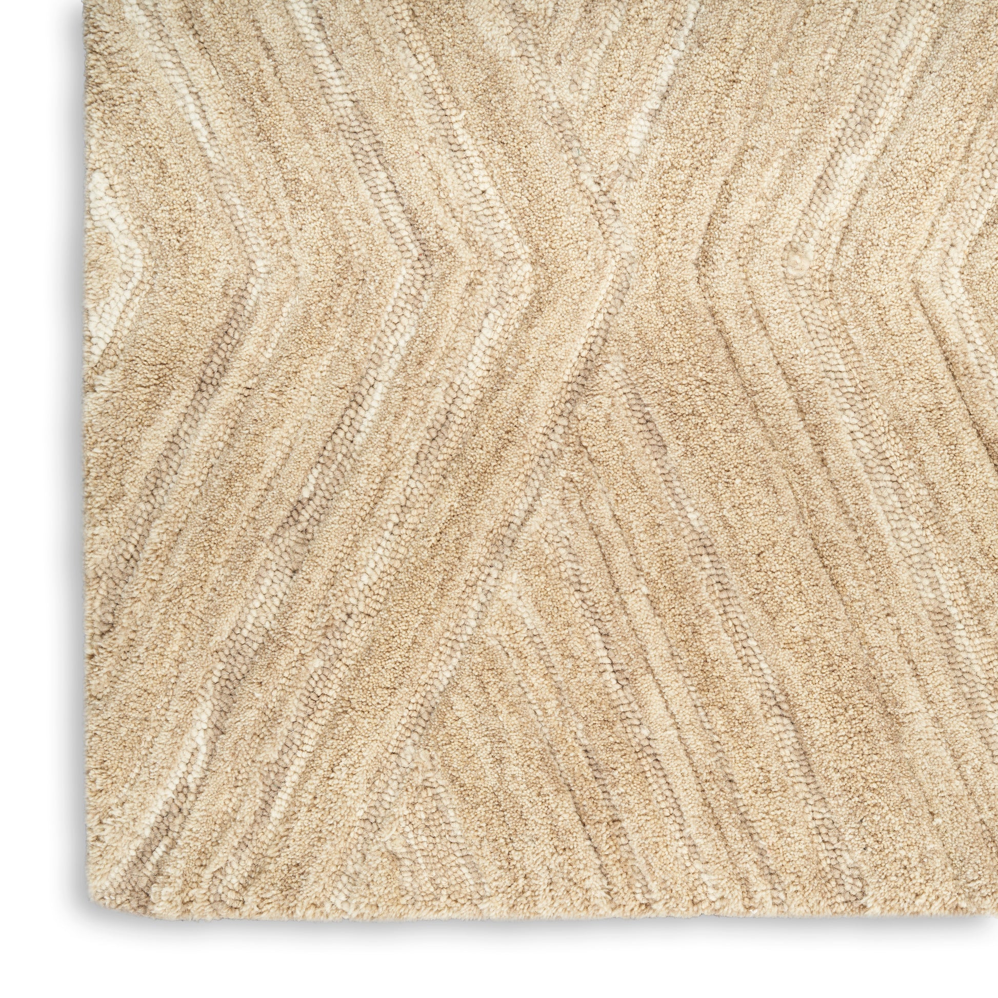 Beige textured area rug with subtle chevron zigzag pattern in cream & tan tones; soft pile, rectangular.