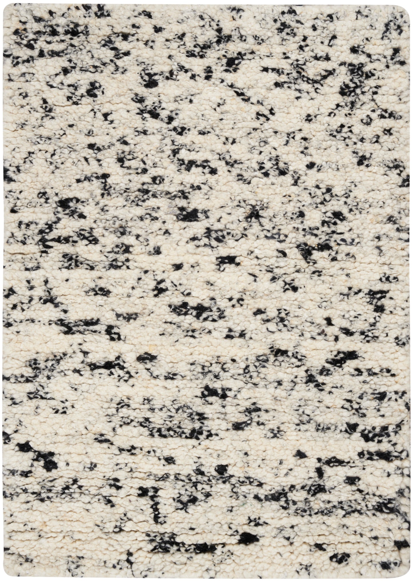 Cream ivory rug with black irregular speckle pattern; plush rounded-corner rectangular area rug for living room.