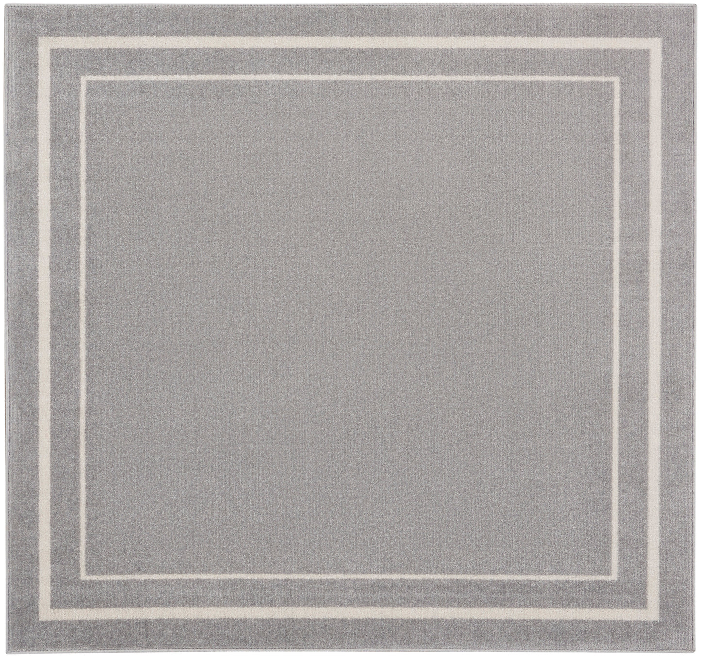 Gray rug with cream nested square borders; modern minimalist style, soft textured pile.