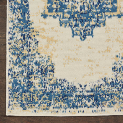 Blue and cream distressed runner rug with abstract medallion pattern, beige center, on wooden floor.
