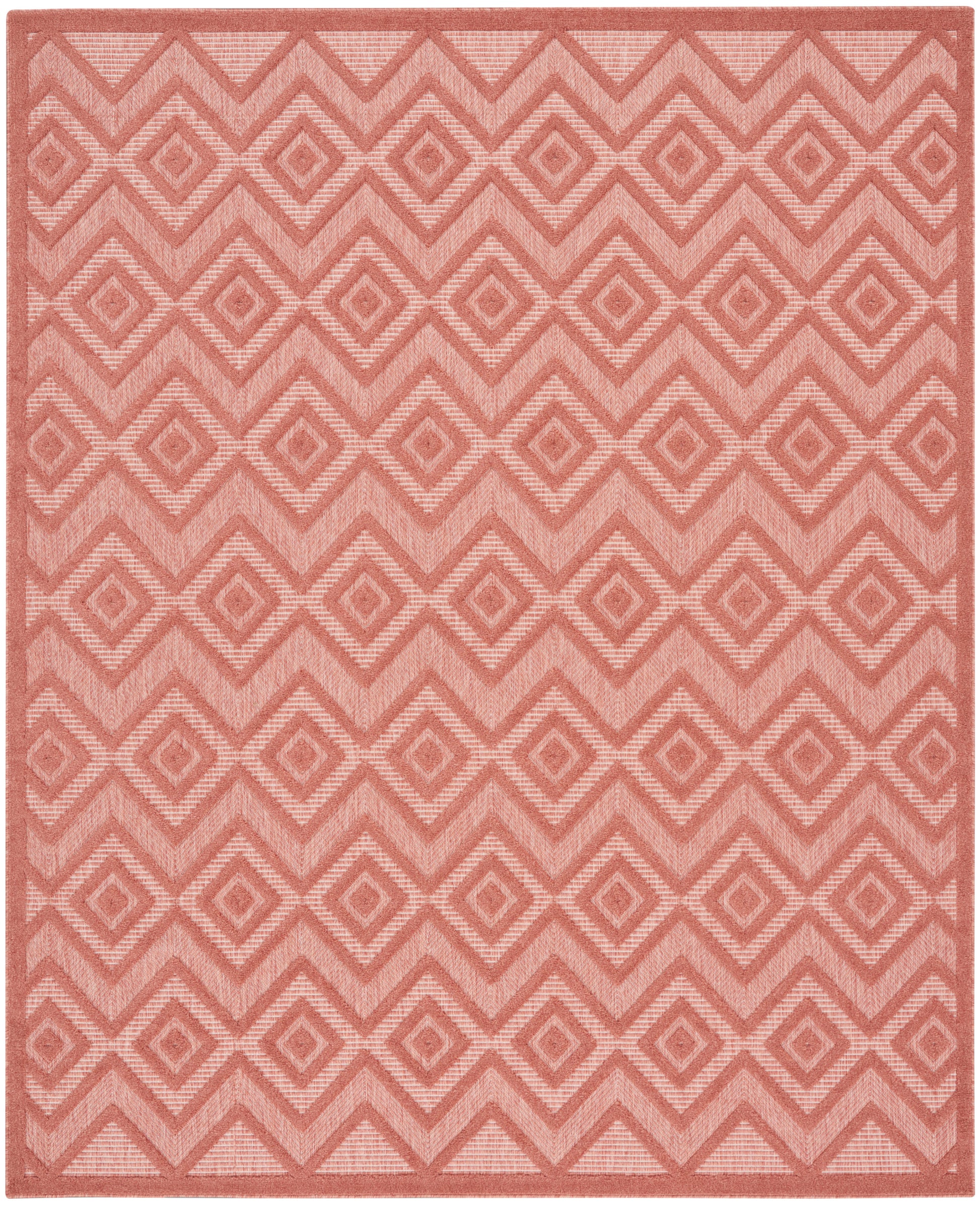 Coral pink rug with repeating diamond and chevron pattern, soft textured weave and subtle border.