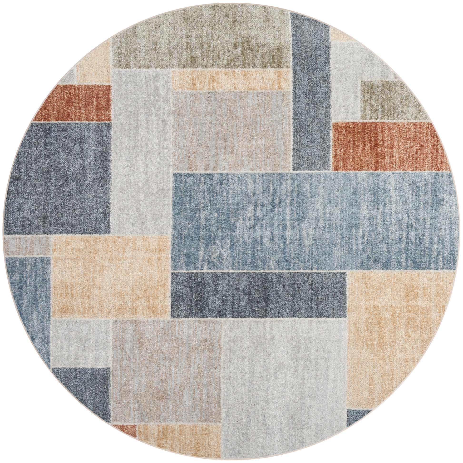 Round patchwork area rug with rectangular blocks in muted blues, beiges, creams, grays, and rust tones.