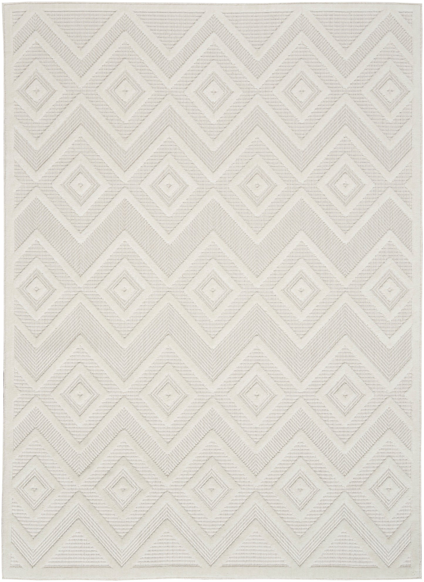 Cream geometric rug with raised diamond pattern and chevron zigzags; textured woven surface.