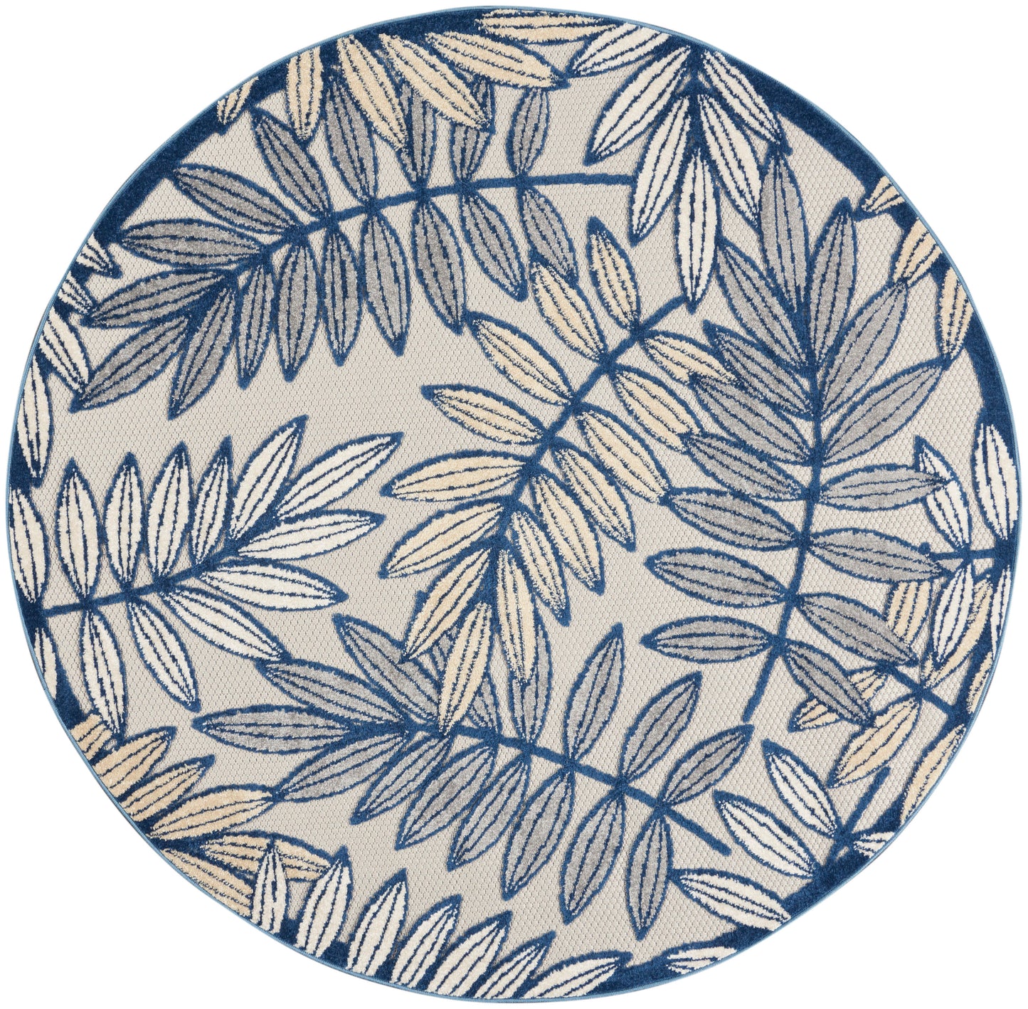 Round rug with beige background and navy-blue botanical leaf pattern.