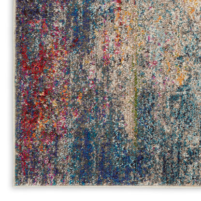 Abstract multicolor shag rug with dense, speckled pile in blues, reds, beiges & teals.