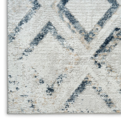 Cream ivory rug with navy geometric diamond/chevron pattern; plush pile, modern area rug.