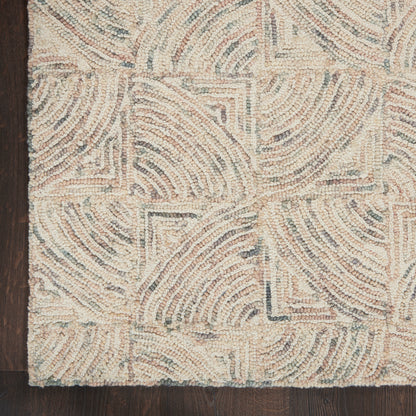 Beige textured rug with geometric swirling arc patterns in a looped pile on a dark wood floor.