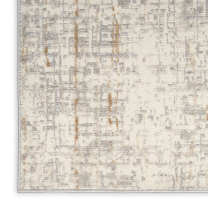 Neutral beige cream area rug with soft gray and tan abstract geometric motif; plush, high-pile, modern style.