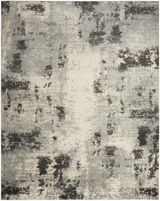 Rectangular abstract area rug with a distressed grey, charcoal and ivory pattern; modern, neutral decor, ideal under a coffee table.