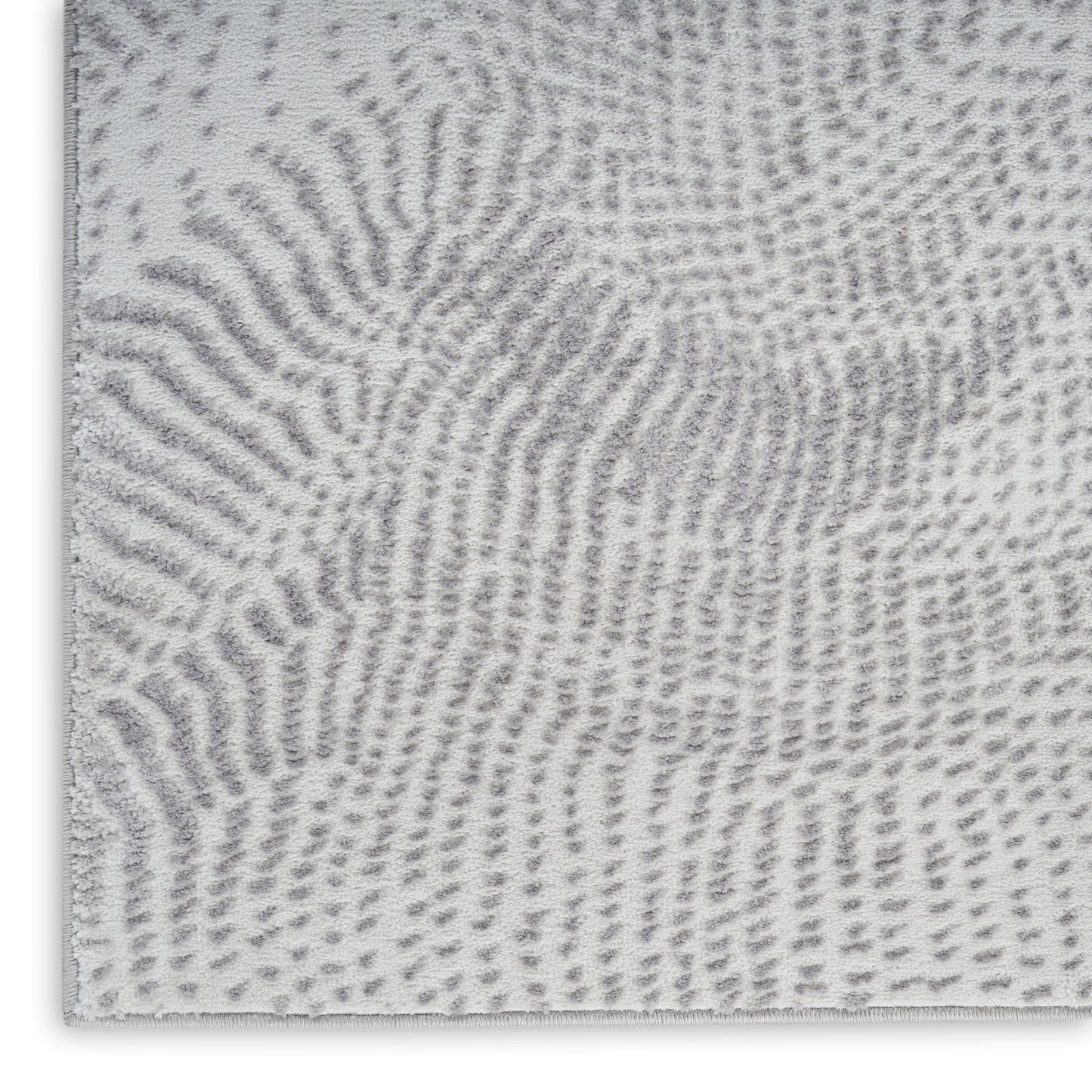 Soft gray and white shag runner rug with an abstract fingerprint pattern.