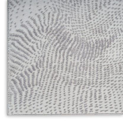 Soft gray and white shag runner rug with an abstract fingerprint pattern.