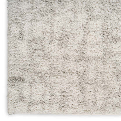 Cream high-pile shag rug with dense plush fibers; rectangular and cozy for living room decor.