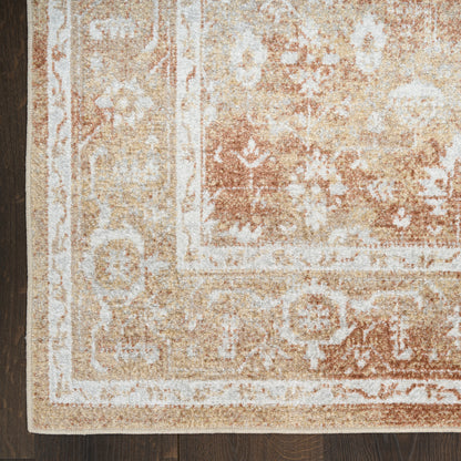 Distressed beige and tan oriental rug with ivory border and floral medallions on dark wood floor.