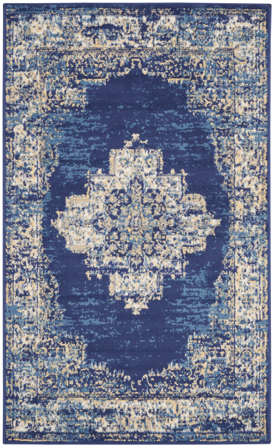 Rectangular blue distressed oriental rug with ivory and gold central medallion and ornate border.