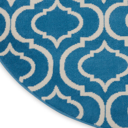 Blue and white arabesque lattice rug, close-up corner.