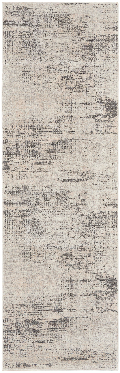 Beige distressed abstract runner rug with gray charcoal patches; modern, low-pile hallway decor.
