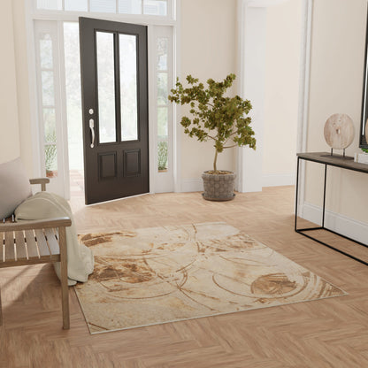 Entryway with black front door, beige patterned rug, light wood floor, bench with throw, potted tree, and console table decor.