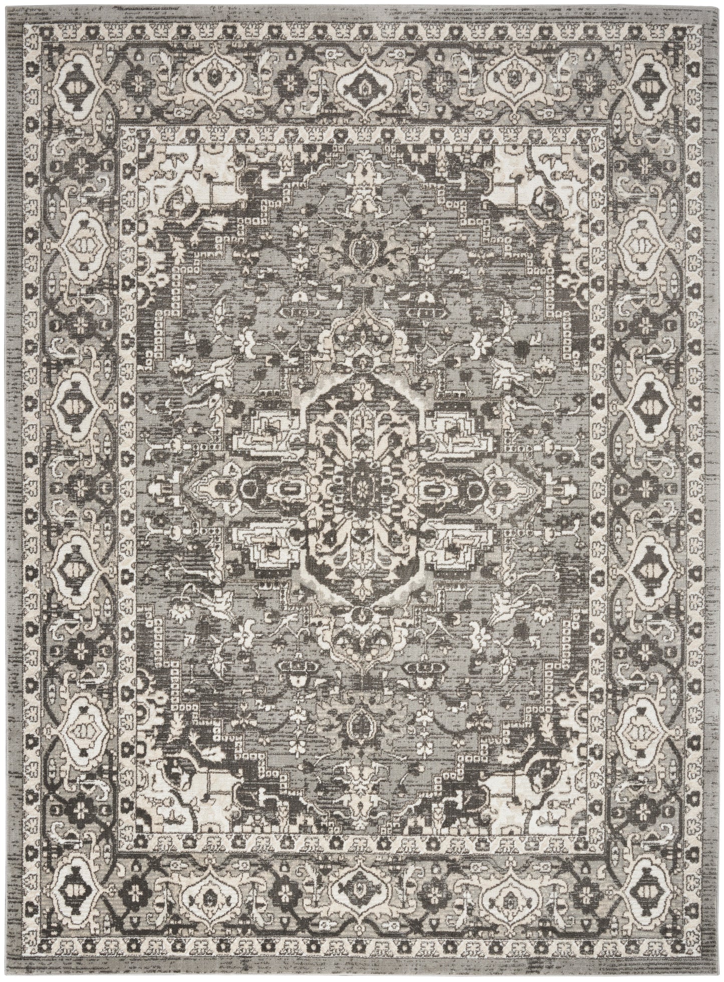 Distressed grayscale Persian-style rug with central medallion and ornate floral border in ivory, taupe & charcoal.