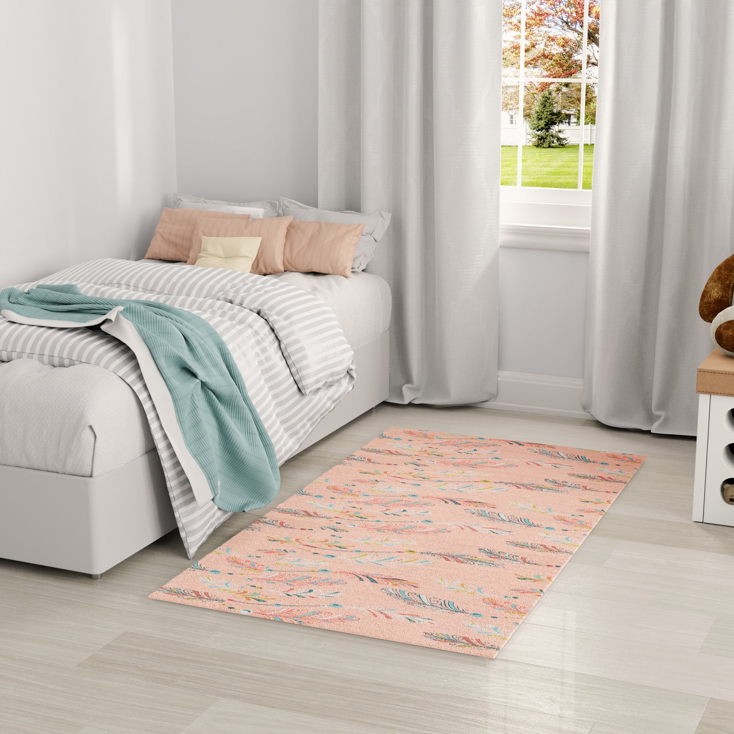 Gray bed with striped duvet, mint throw, peach cushions; peach rug, white curtains, bright window view.