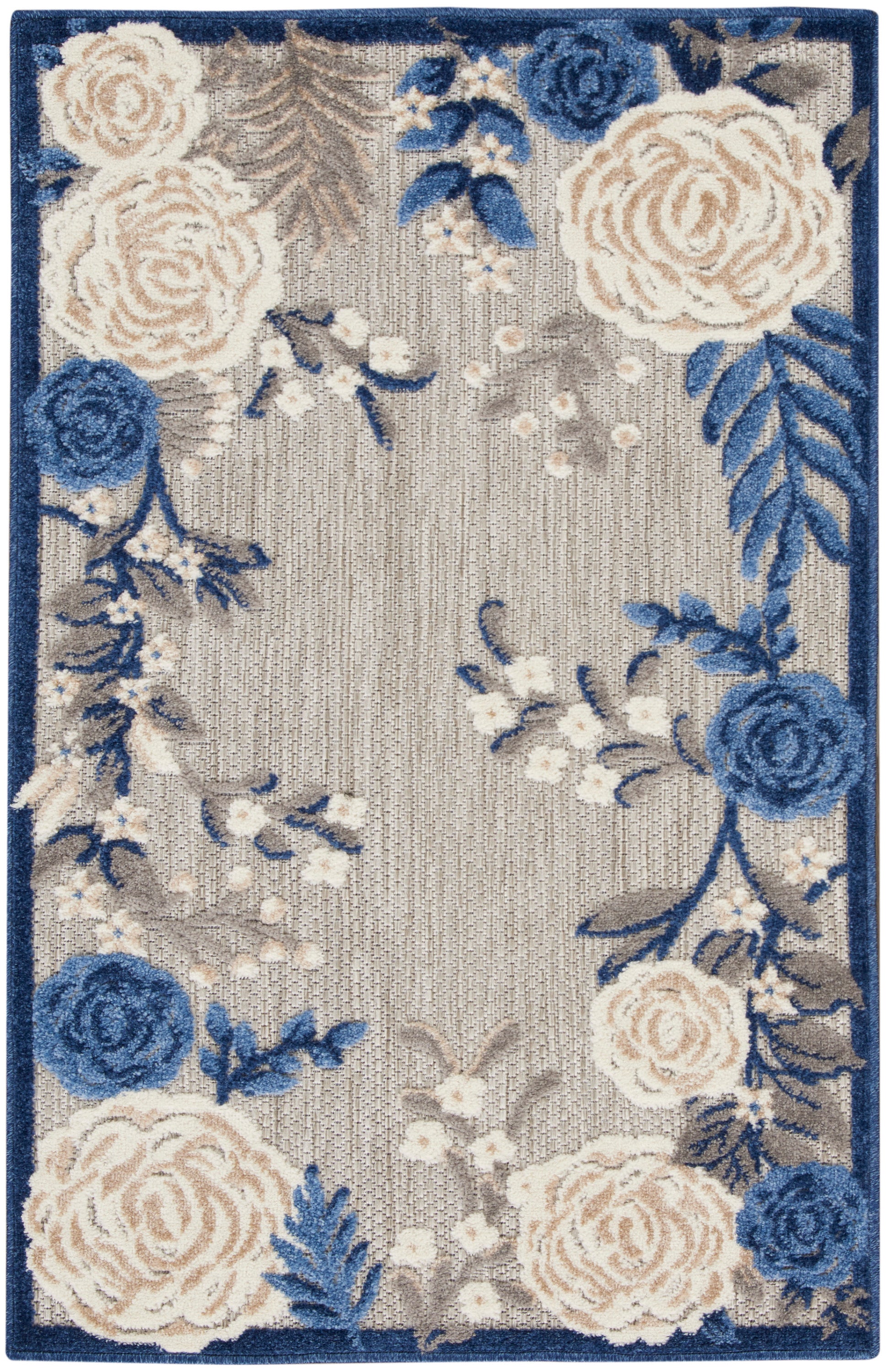 Rectangular area rug with beige background, blue and ivory floral roses, navy border, tufted textured look.
