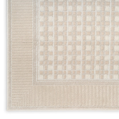 Beige woven area rug with a square grid pattern and textured border; neutral, contemporary décor for living spaces.