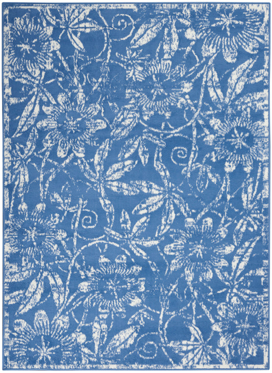 Rectangular blue rug featuring white floral damask pattern with intertwined vines.
