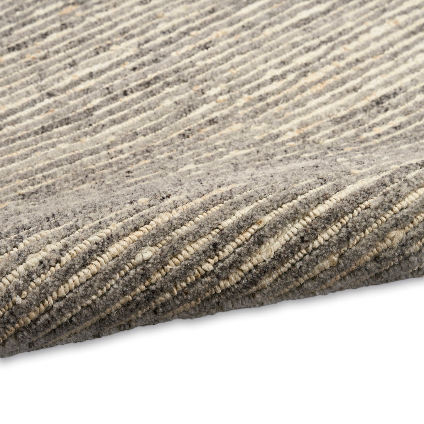 Gray and beige striped plush rug with soft, dense pile and subtle texture.