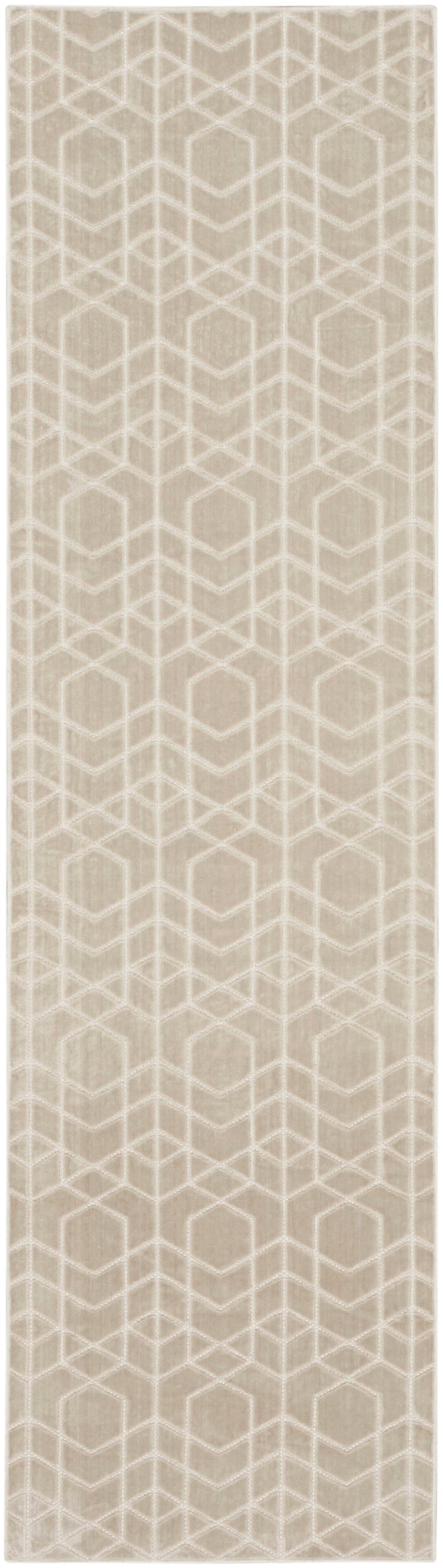 Beige rug with a white geometric hex lattice pattern and a vertical repeating motif.