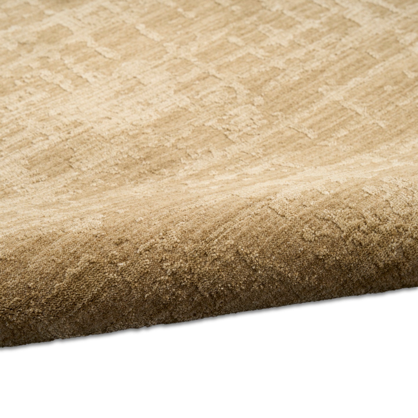 Neutral beige cut-pile area rug with a subtle geometric pattern and rolled edge.