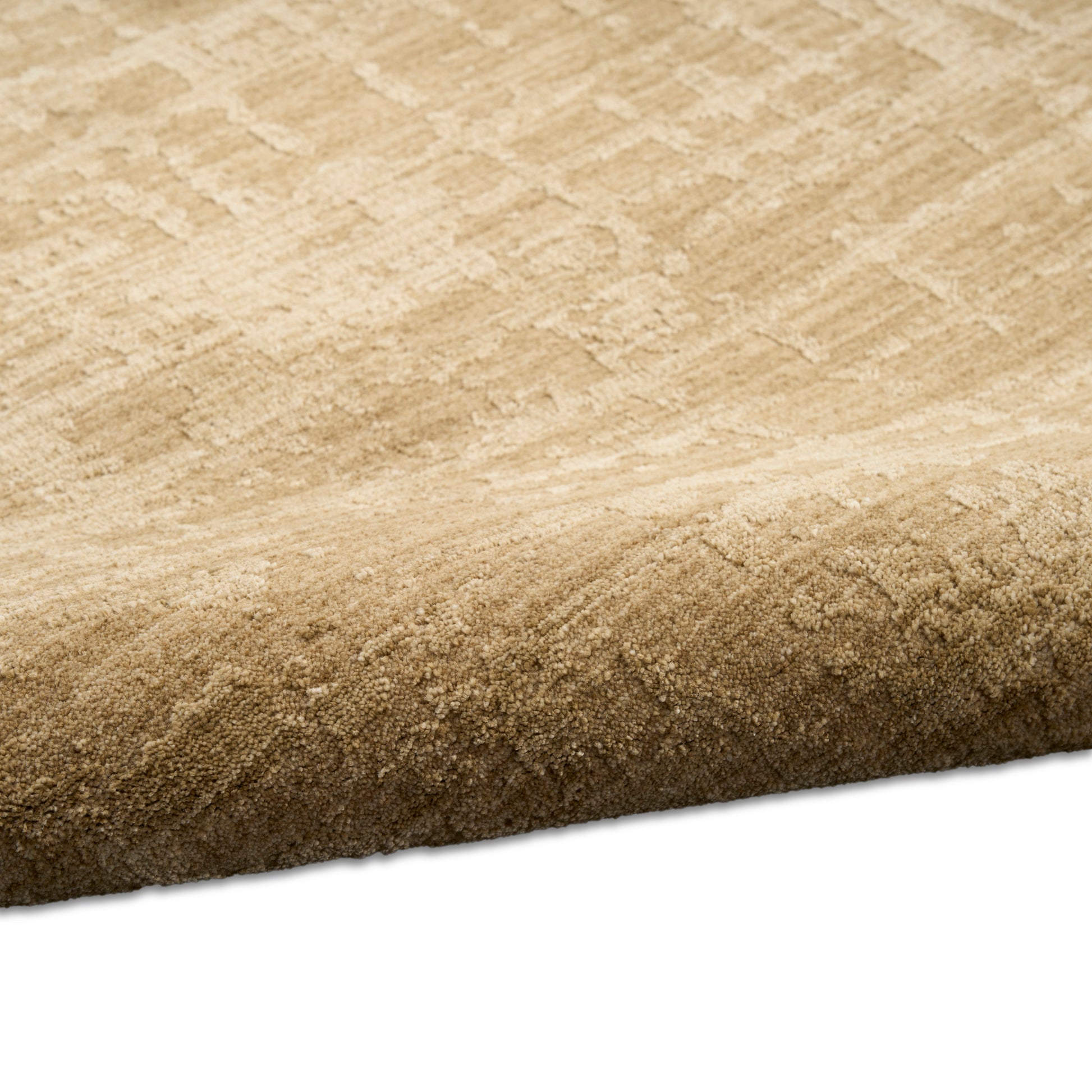 Neutral beige cut-pile area rug with a subtle geometric pattern and rolled edge.
