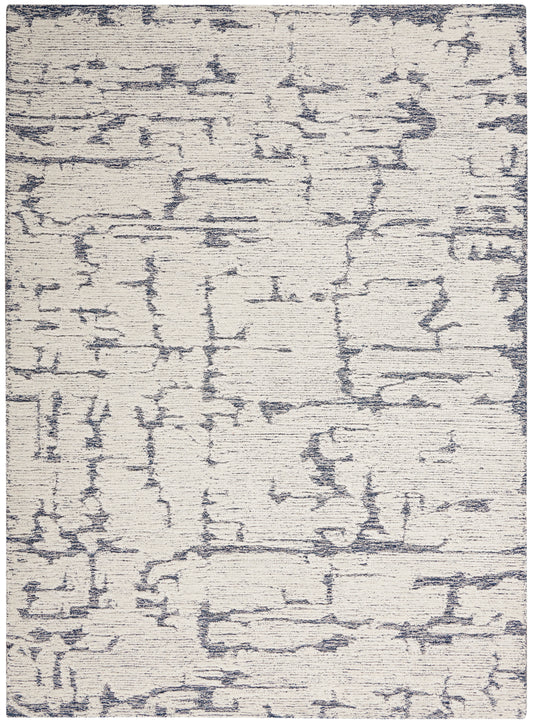 Cream area rug with blue-gray abstract lines; contemporary, textured pile.