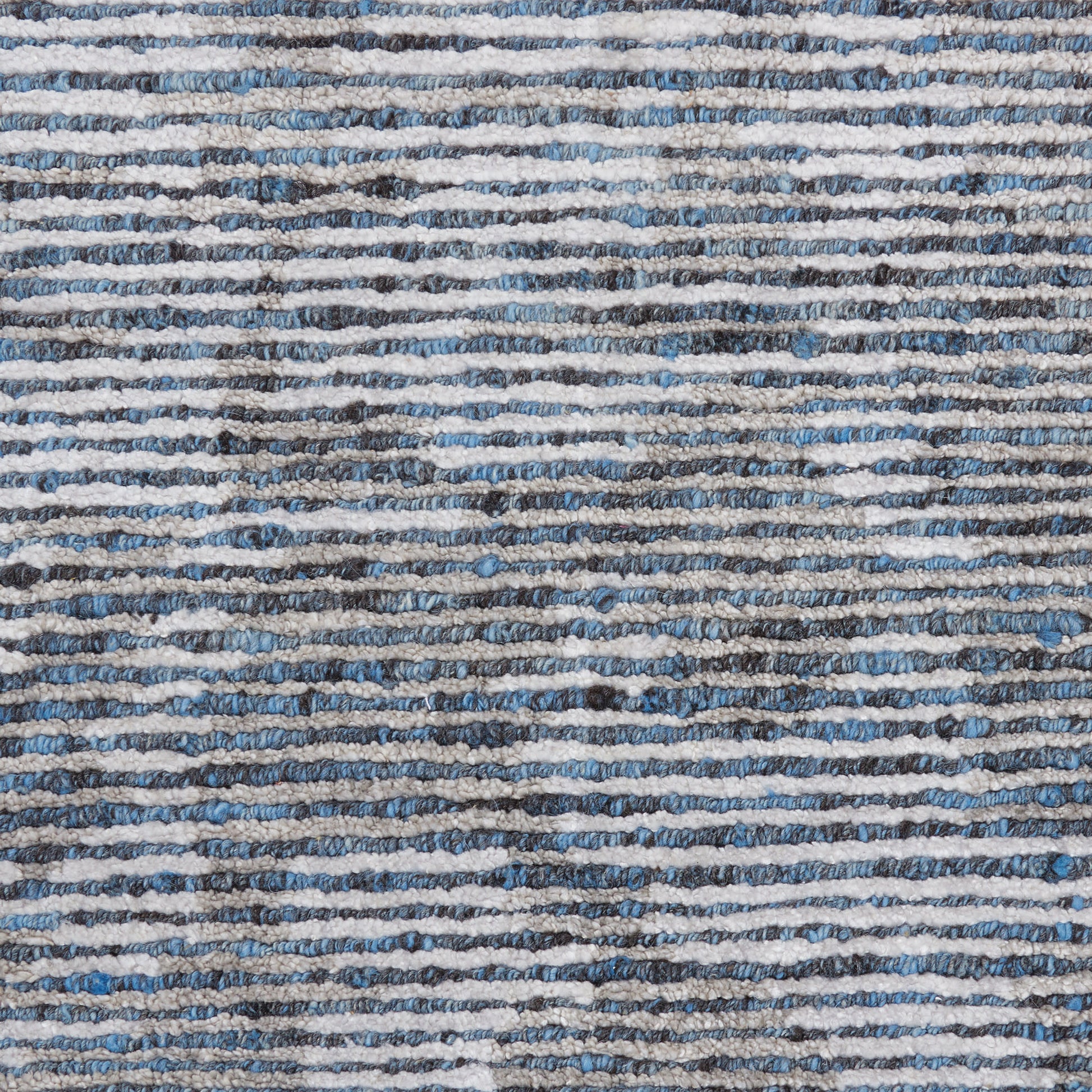 Blue & gray striped woven rug with textured loop pile for casual home decor.