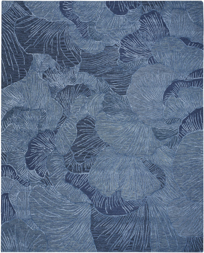 Blue abstract leaf pattern with overlapping ginkgo-like leaves & a textured, fabric-like appearance.