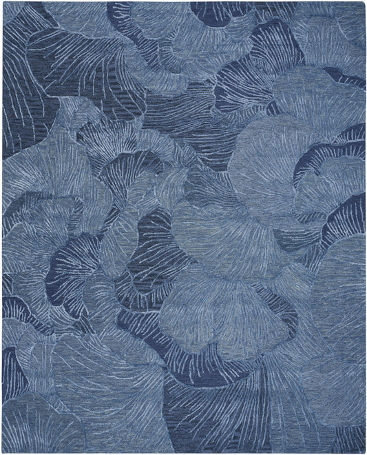 Blue abstract leaf pattern with overlapping ginkgo-like leaves & a textured, fabric-like appearance.