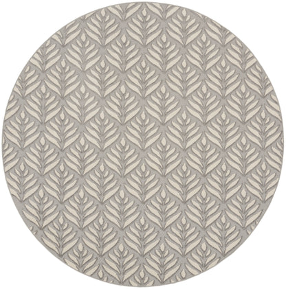 Round rug with beige base and gray botanical leaf pattern, textured woven surface.