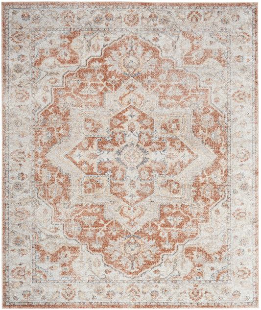 Rectangular distressed oriental rug in rust, ivory and gray with a central medallion and ornate border.