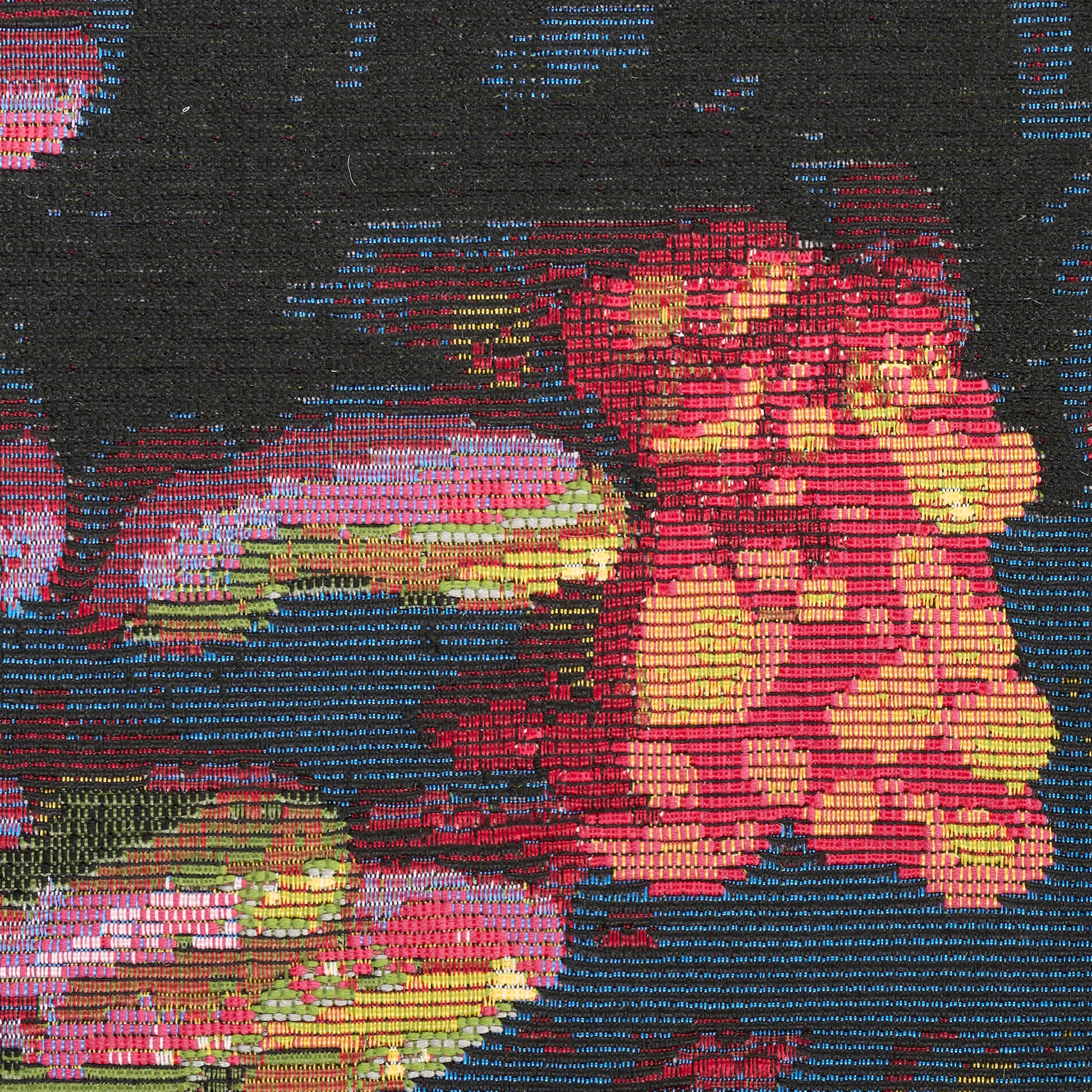 Colorful woven rug featuring pink, yellow and orange flowers with green leaves on a dark blue background.