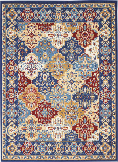 Persian-style area rug with blue, ivory, red and gold tones; intricate floral medallions and a decorative border.