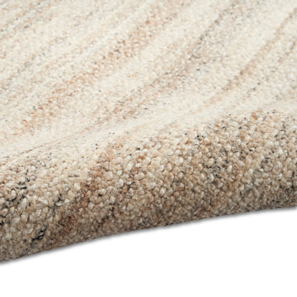 Beige Berber-style rug with cream, tan and gray loop pile; rolled edge visible.