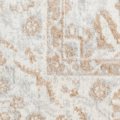 Distressed light gray area rug with warm tan traditional motif; plush, decorative home accent.