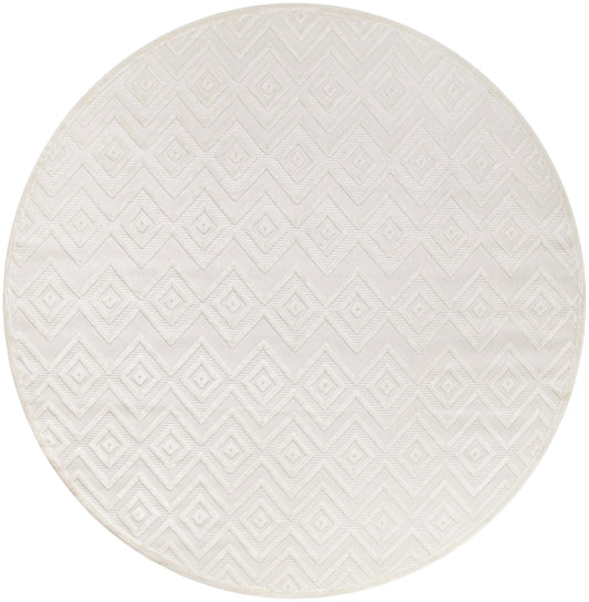 Round cream rug with geometric diamond chevron pattern and subtle woven texture.