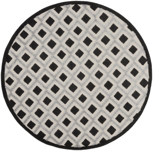 Round rug with light gray field and black diamond lattice pattern, black edge.